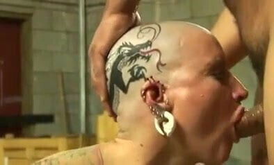 Tattoed pierced bald head slut nailed