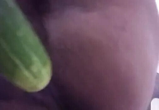 Wife plays with cucumber