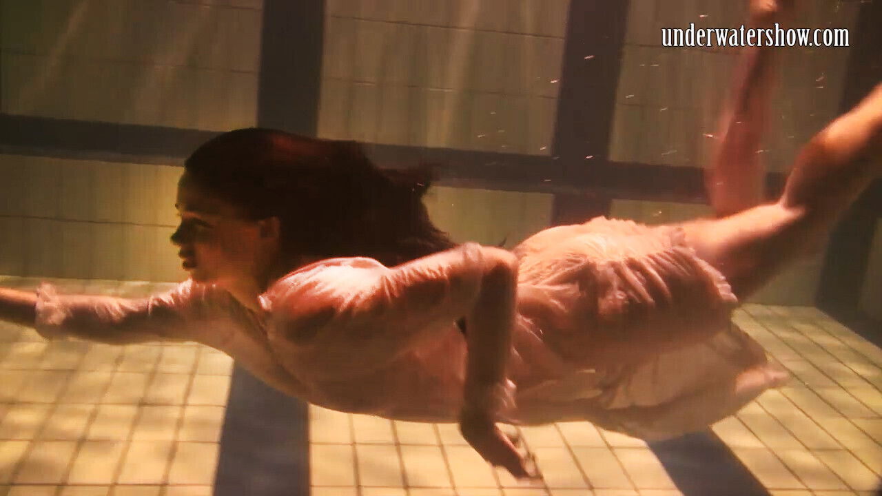 Babes swim naked underwater