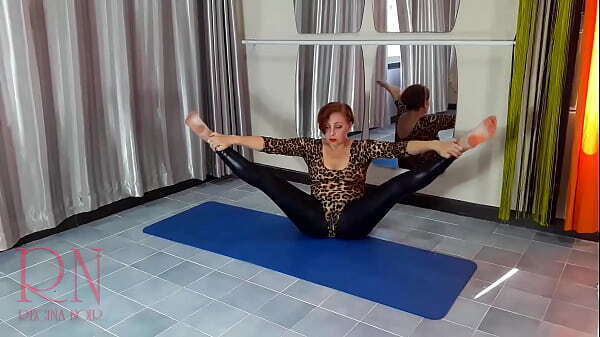 Regina Noir. woman leopard bodysuit latex leggings doing yoga gym. Yoga sexy leotards.