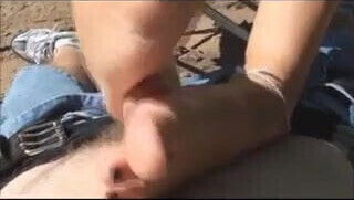 Bitch giving footjob on the beach-black toes.