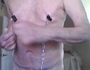 Nip torment with clamps and weights