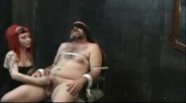 Redhead mistress milking tied slave