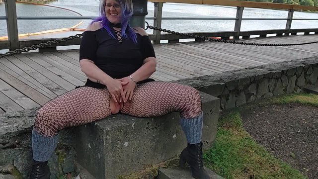 Blue haired Woman risky mastrubates public business park