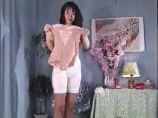 Japanes lady putting tight bodysuit.