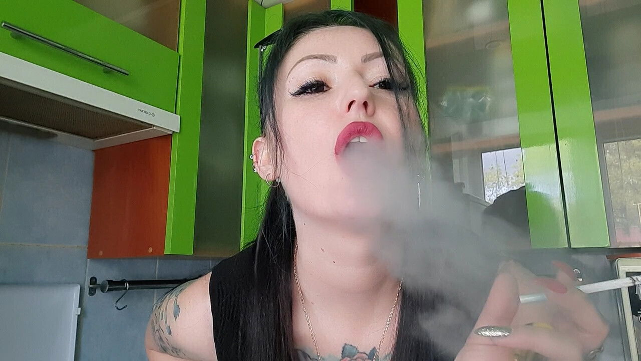 Gorgeous Dominatrix smokes your face. Smoking fetish. Smoke fetish.