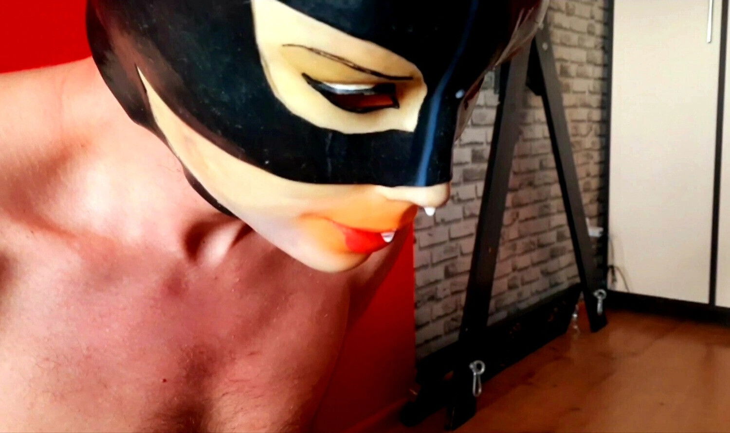 Sperm games. Dominatrix Nika poured condom with sperm slave's head. condom.