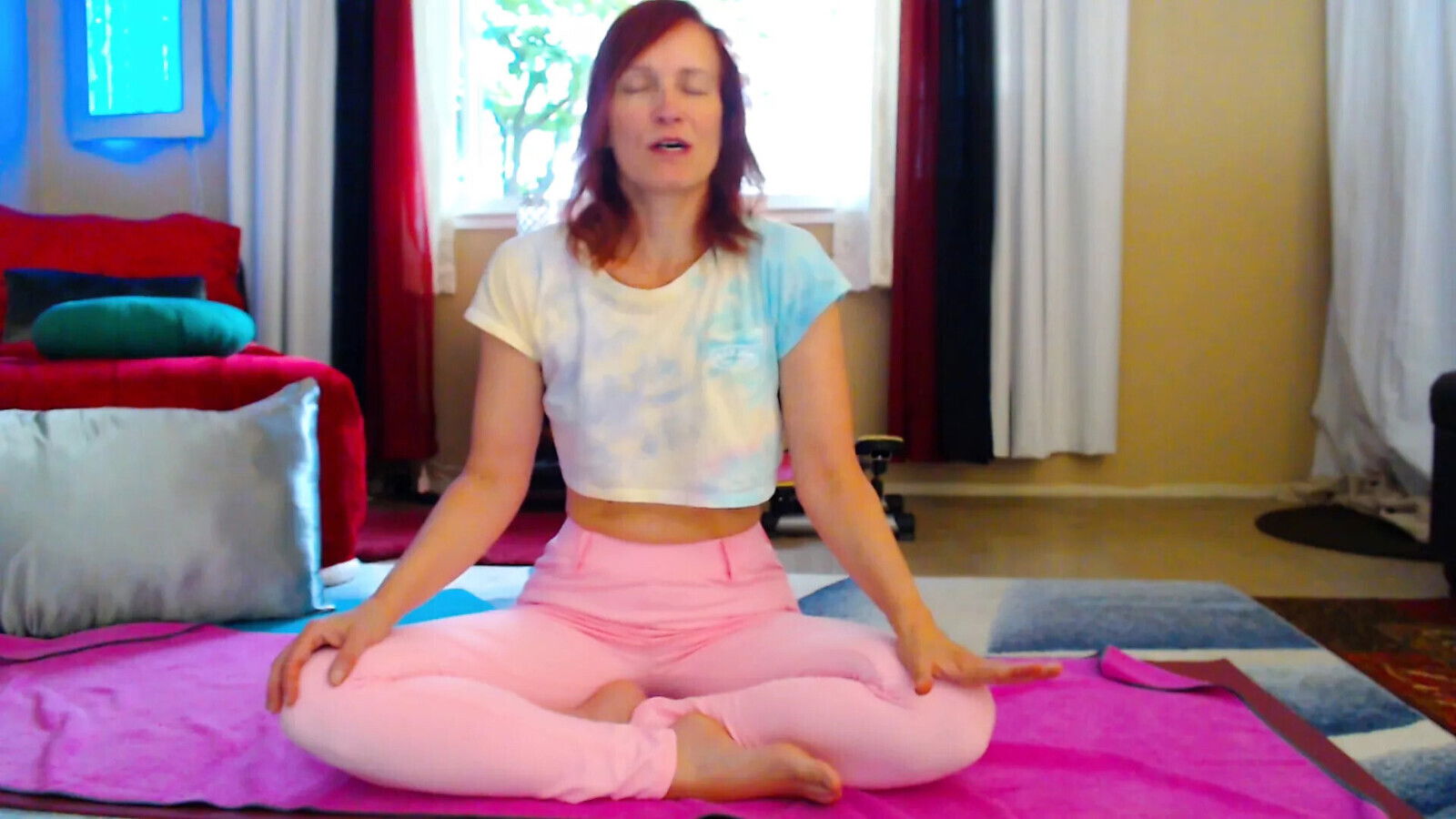 Aurora Willows stretching pink pants crop