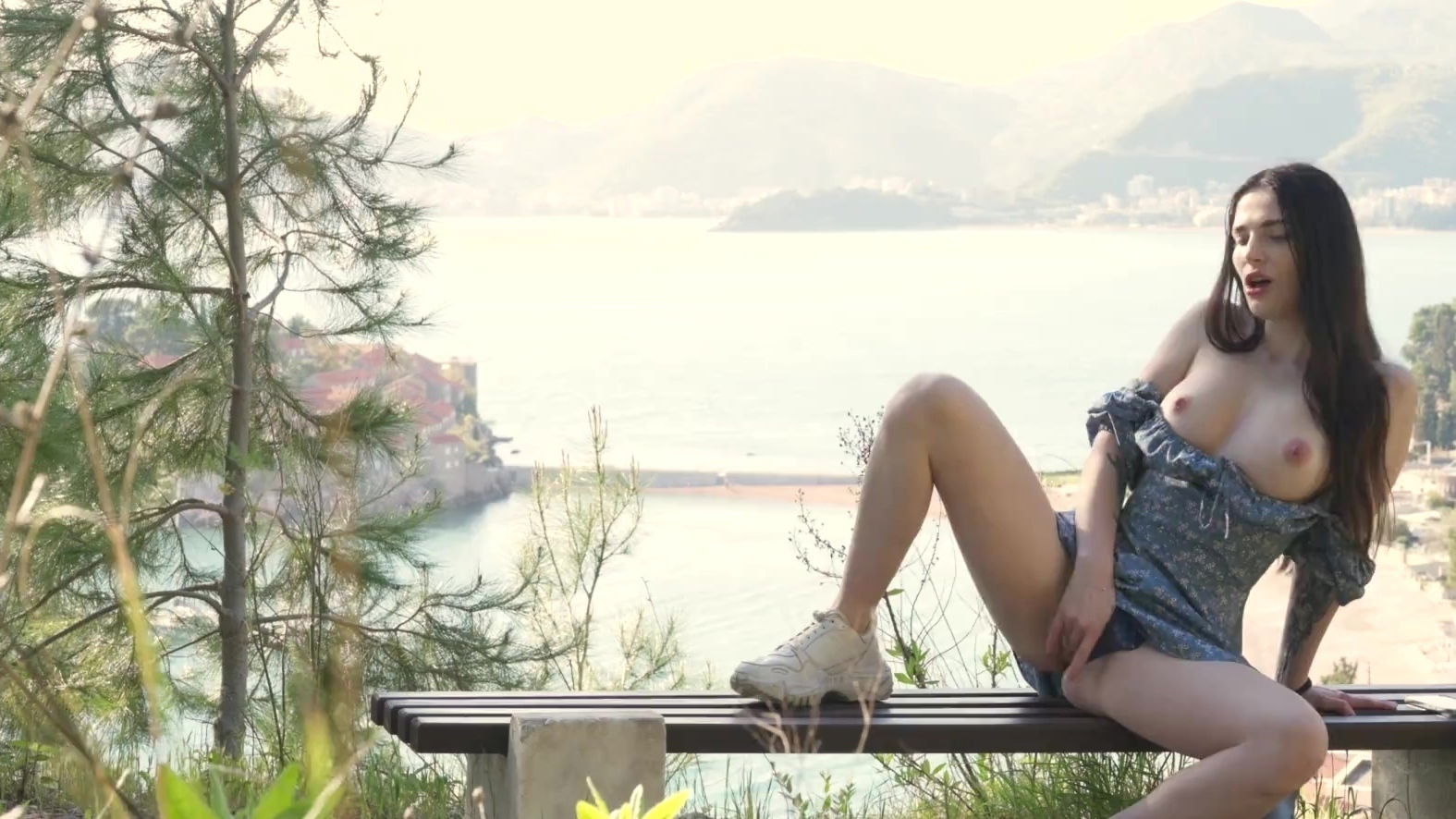 Gorgeous girl filming herself masturabating bench park