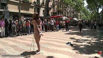 Bound brunette posing naked in public