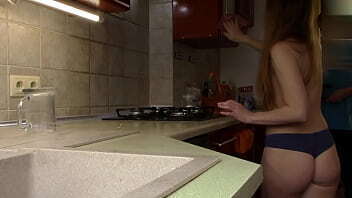 friend Shoots Naked beauty cleans kitchen.