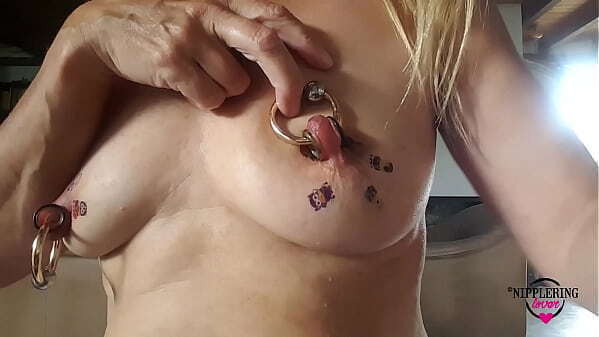 nippleringlover horny milf sticking tattoos huge pierced nipples close