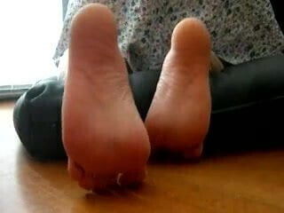 bare soles on her knees