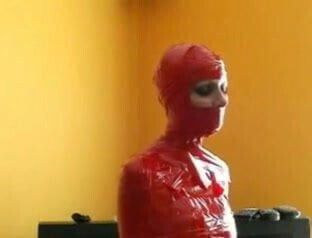Mummified Bondage Babe In Red Tape
