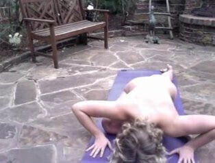 bysty girl doing naked yoga backyard