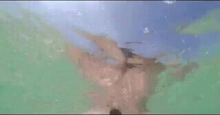 Bottle Insertion In Ocean at Beach