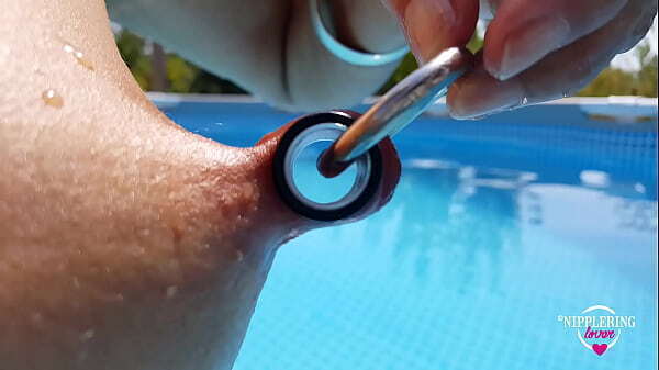 nippleringlover nude pool extreme stretching through pierced nipples close