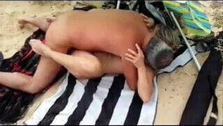 His wife with stranger at the beach