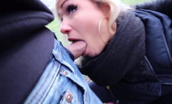 Blonde girl flashes her tits and give stranger a blowjob in public