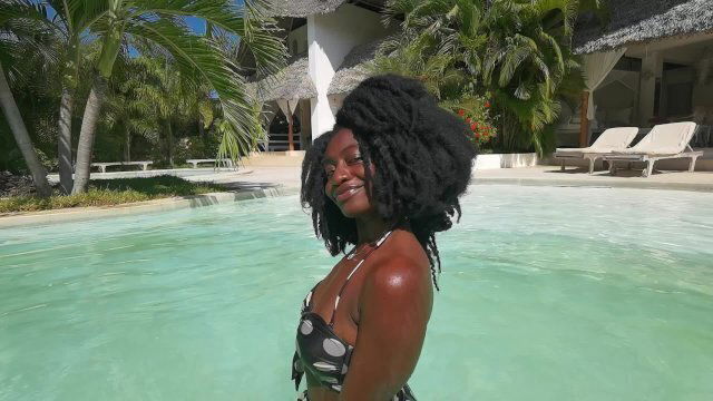 Elegant Delicate African Beauty enjoying Swimming pool
