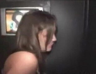 Mature works the gloryhole booth