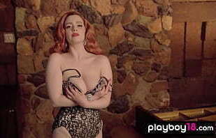 Redhead MILF Minxie Mimieux loses her sexy corset and reveals her huge tits