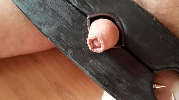 Dominatrix tramples slave'_s little dick with pointed shoes.