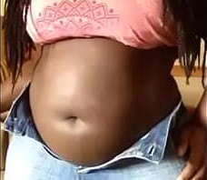 Chubby woman plays with belly and burps