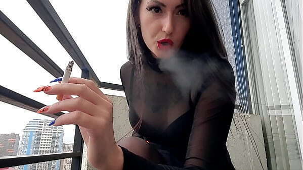 Dominatrix Nika smokes cigarette sexy blows smoke your face. Enjoy!