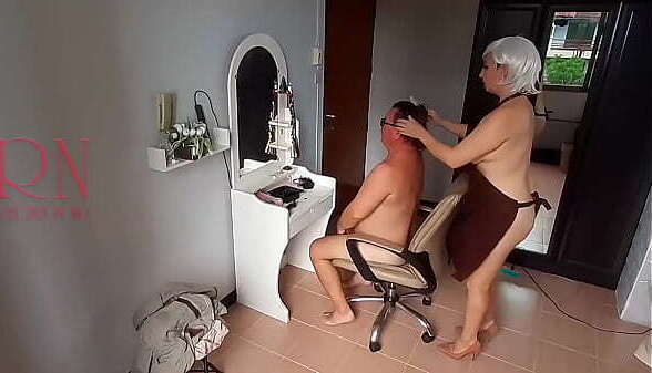 Nudist barbershop. Nude lady hairdresser apron makes client strip. Security camera. client surprised. Scene