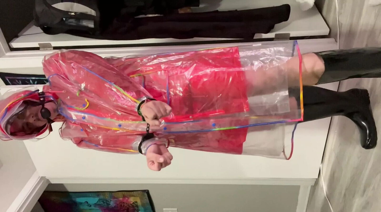 Layering multiple plastic raincoats bondage