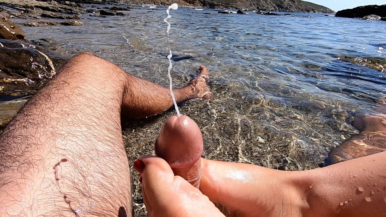 Amateur footjob with cumshot outdoors public beach
