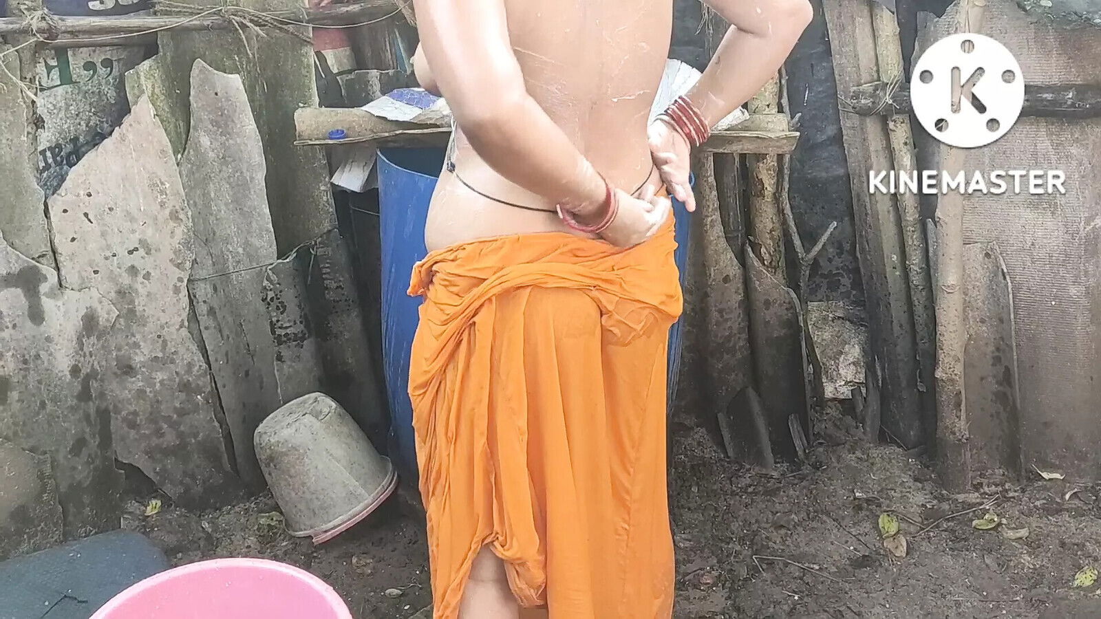 Anita yadav bathing outside with