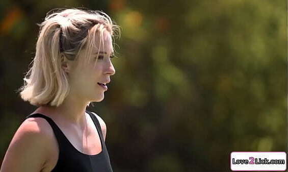 Swimming instructor licks blonde outdoors