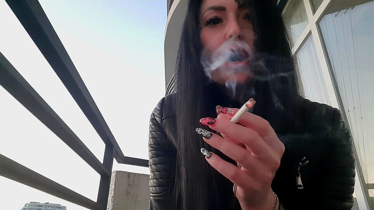 Smoking fetish from sexy Dominatrix Nika. Pretty woman blows cigarette smoke your face
