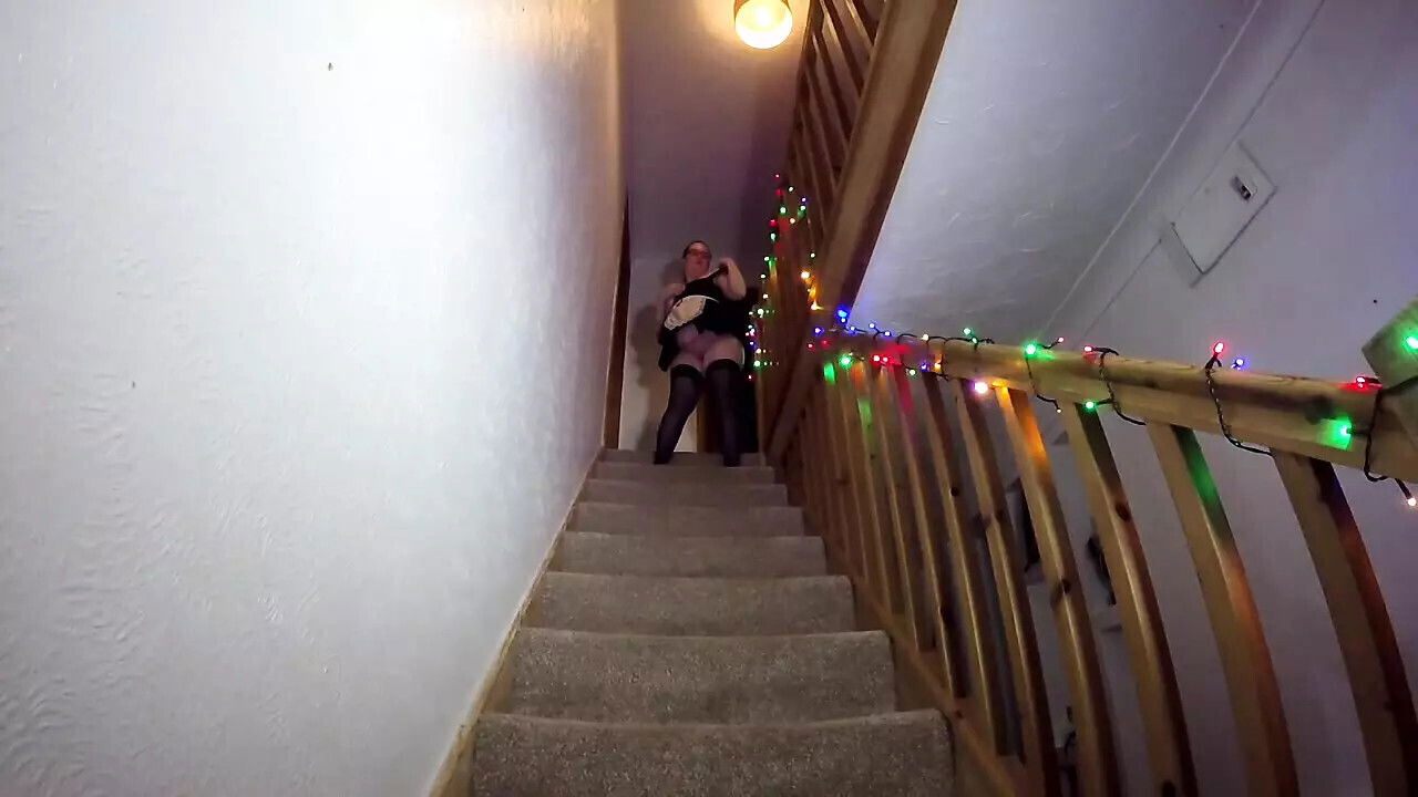 Maid cleaning stairs stockings