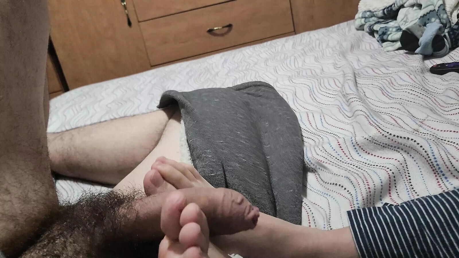 friend playing teases dick with feet