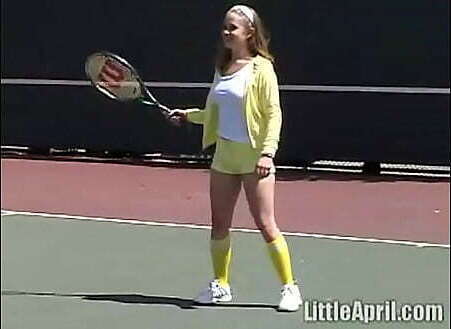 Teen Little April masturbates outdoors after tennis