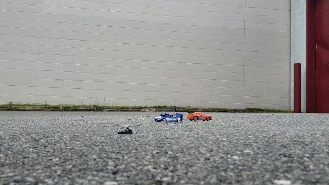 Little Cars Obliterated Under Huge Black Heels