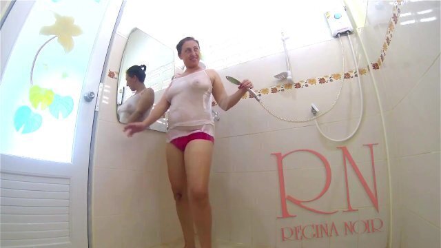 girl bathes shower T-shirt shorts. Shower naked show