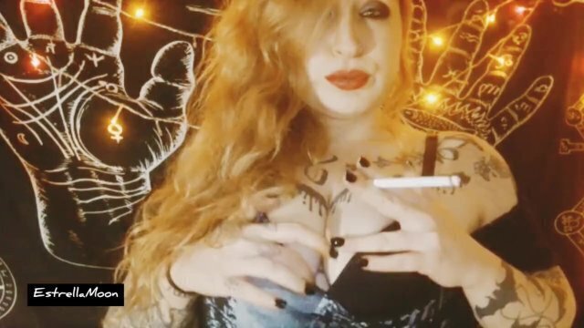 Redhead girl smokes cigarette plays with