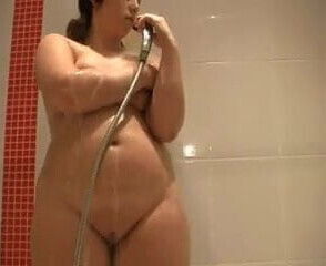 cute chubby playing in the shower