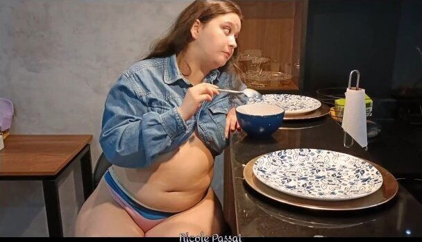 Bloated Girl with Round Belly Keeps Eating