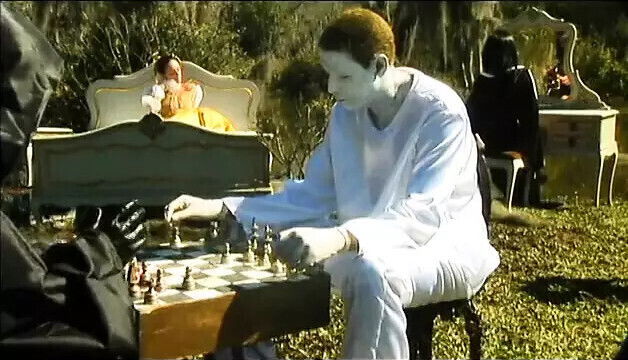 Horny young slut takes throbbing shaft down throat threesome