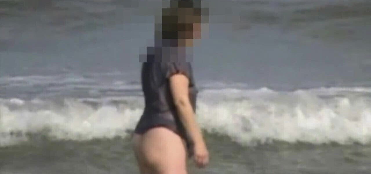 Wife wearing a see-thru top in the surf at Studland.