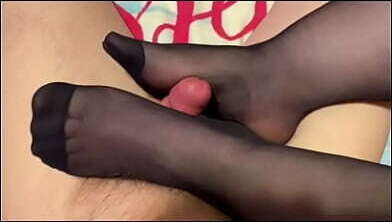 Putting knee highs then giving husband footjob