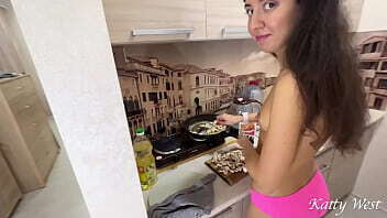 Interrupted wife with while cooking dinner