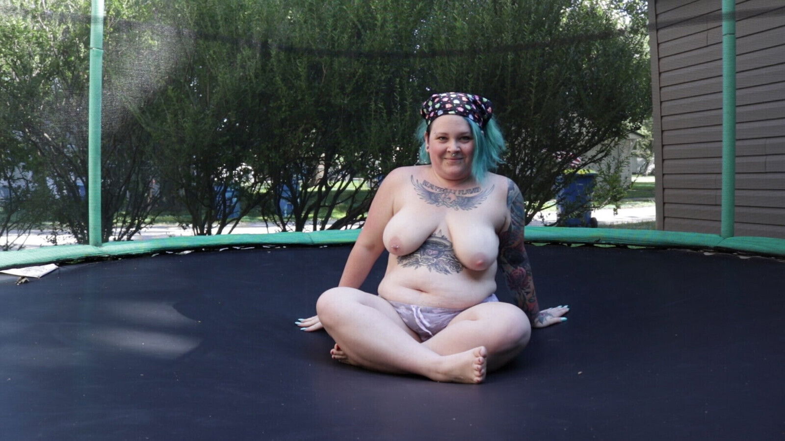 Tattooed Milf Jumping Stripping Trampoline