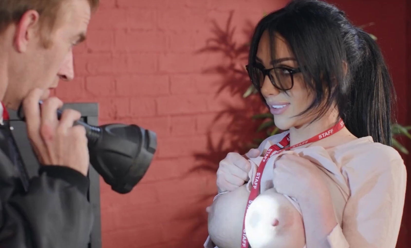 Daniels distracts office guard with body while hacking.