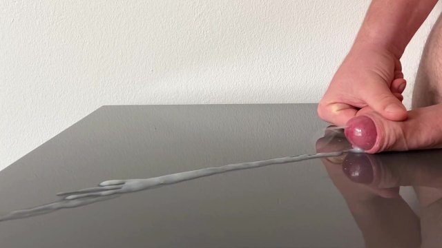 Huge cumshot reflecting table after days edging